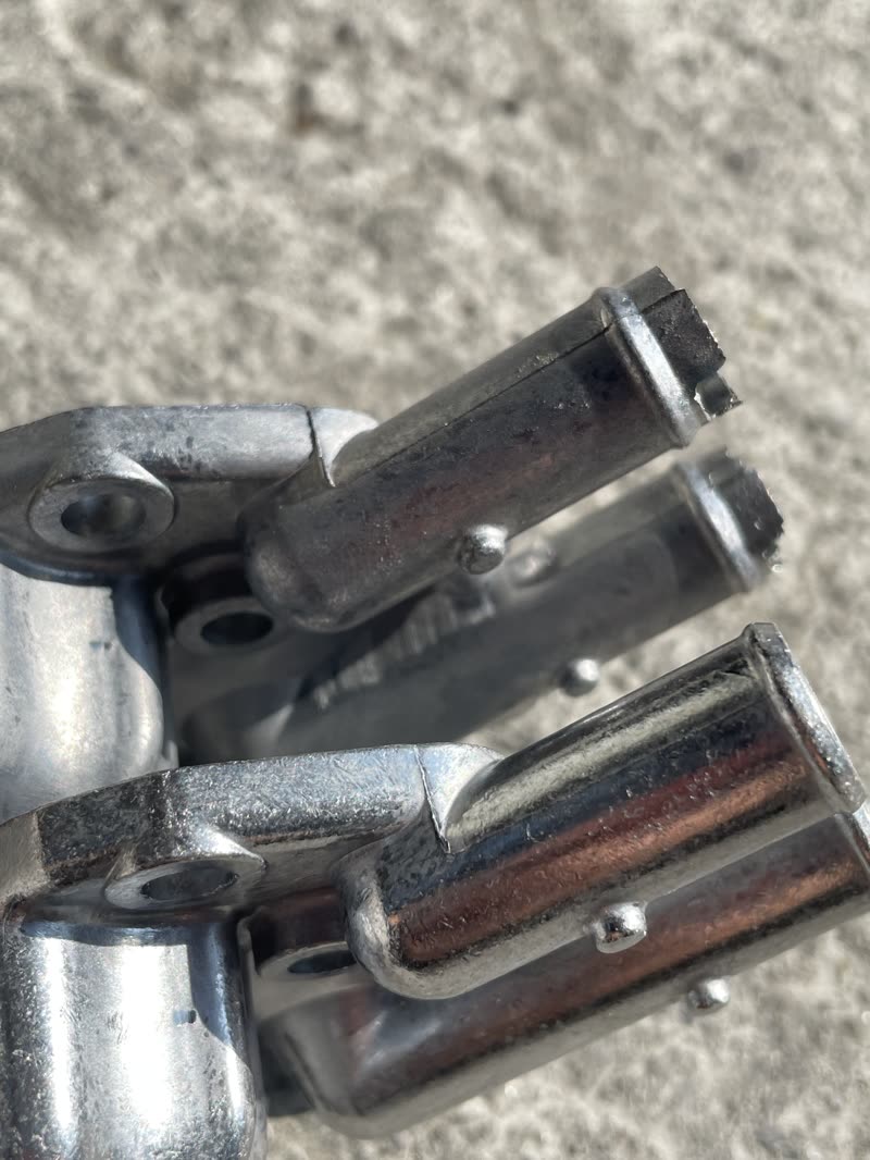 Close-up of cast aluminum parts showing excess material at the ends
